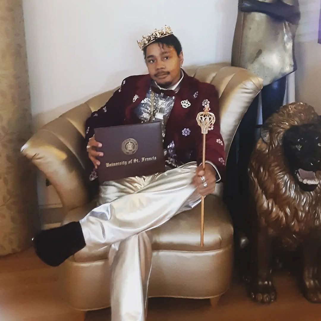College graduation with crown and scepter